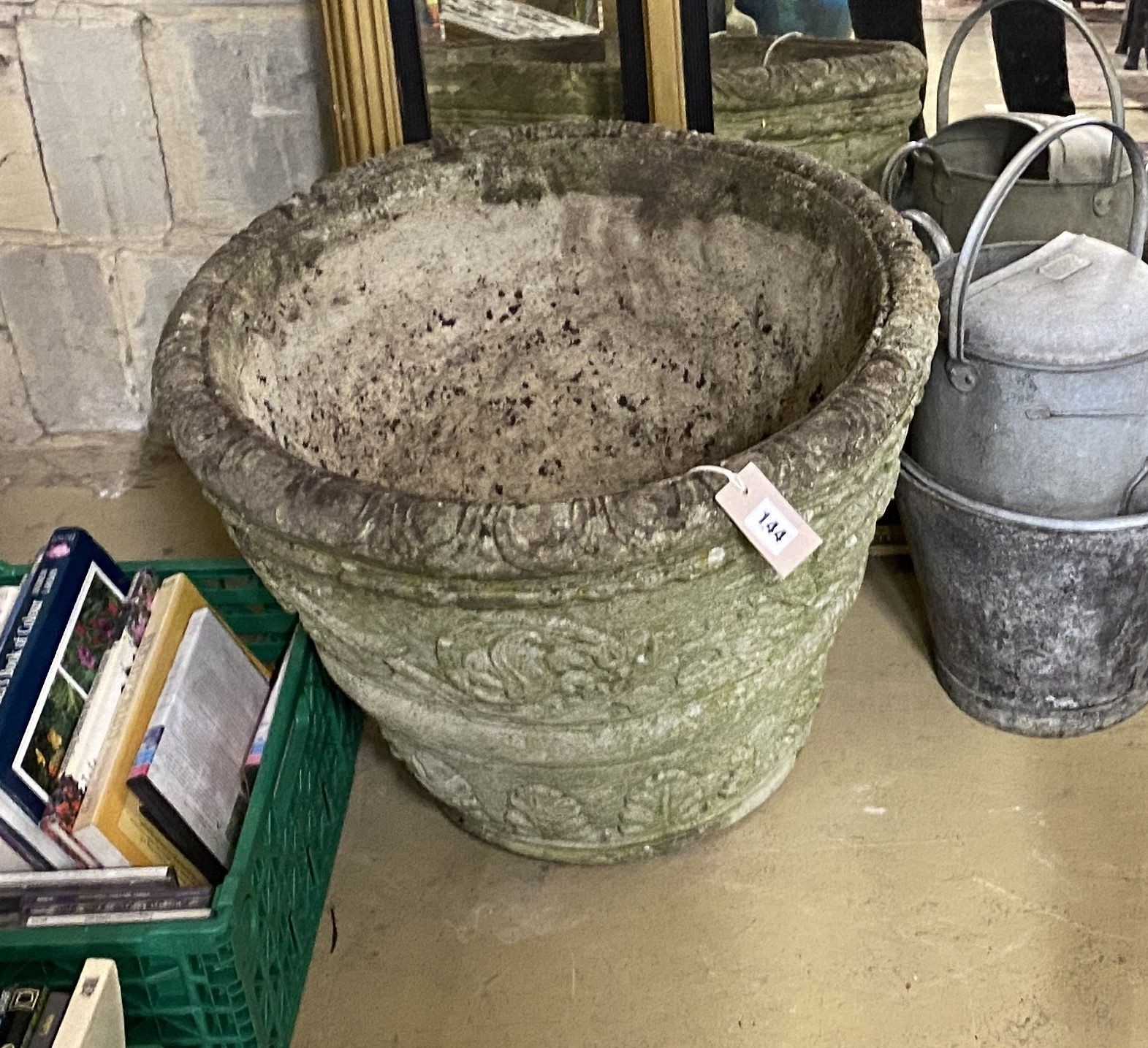 A large circular reconstituted stone garden planter, diameter 54cm, height 44cm